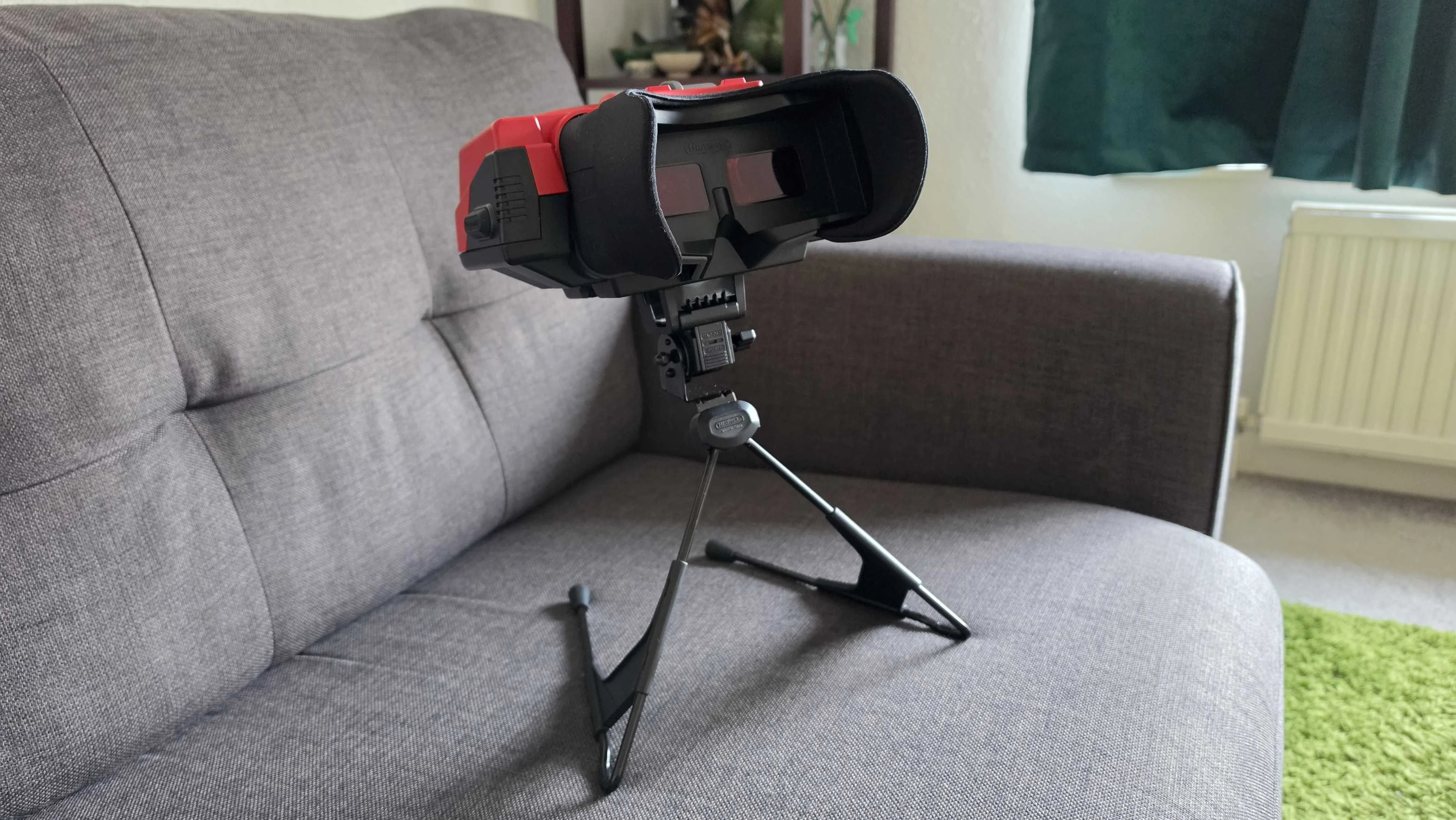 The Virtual Boy on a gray sofa