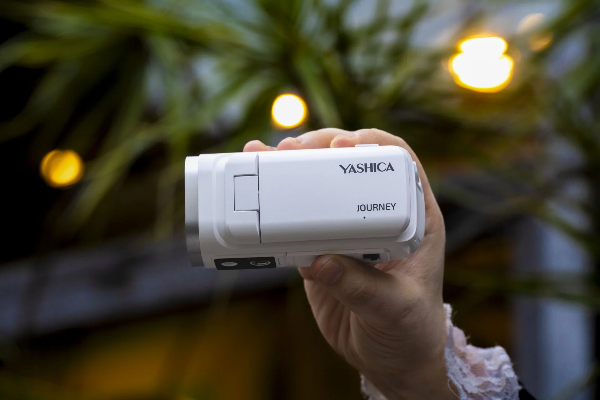 Yashica Journey 4K camcorder in white, in user's hand
